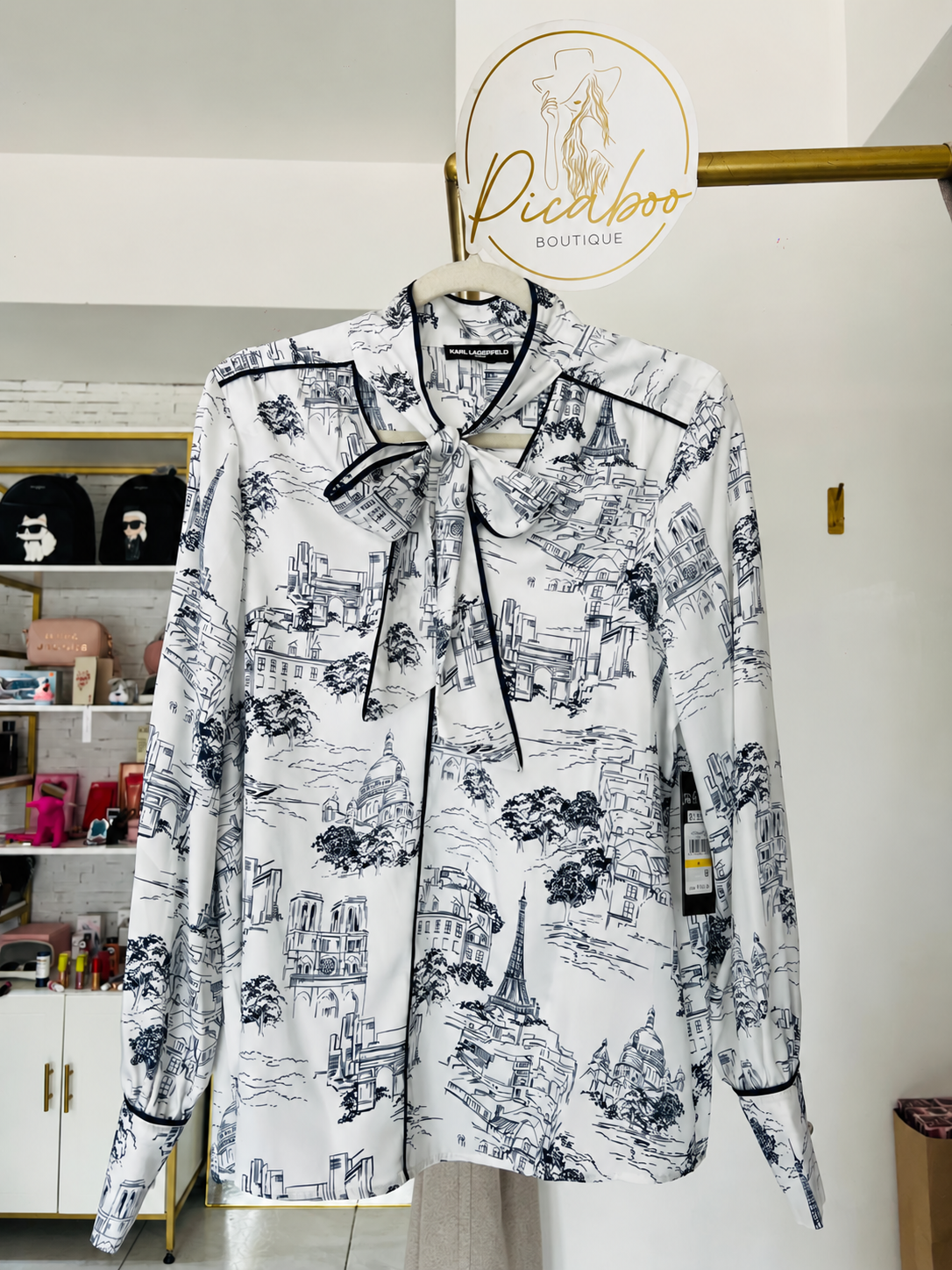 Blusa Karl Lagerfeld blanca con estampado de París y lazo