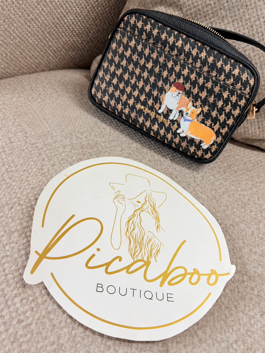 Bolsa crossbody Michael Kors con diseño de perritos