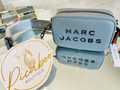 Bolsa Marc Jacobs azul claro con letras negras