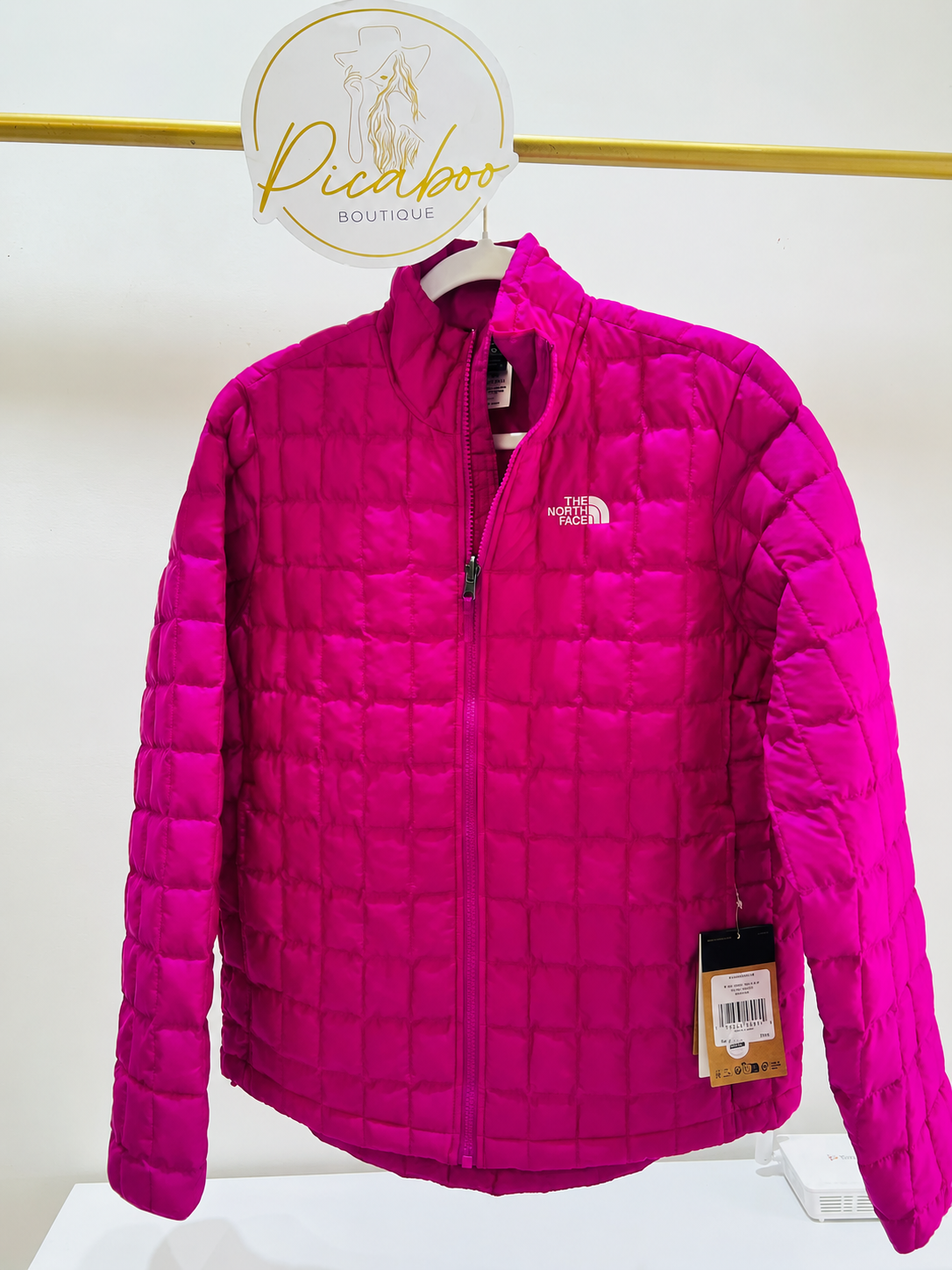 Chamarra The North Face fucsia acolchada para dama