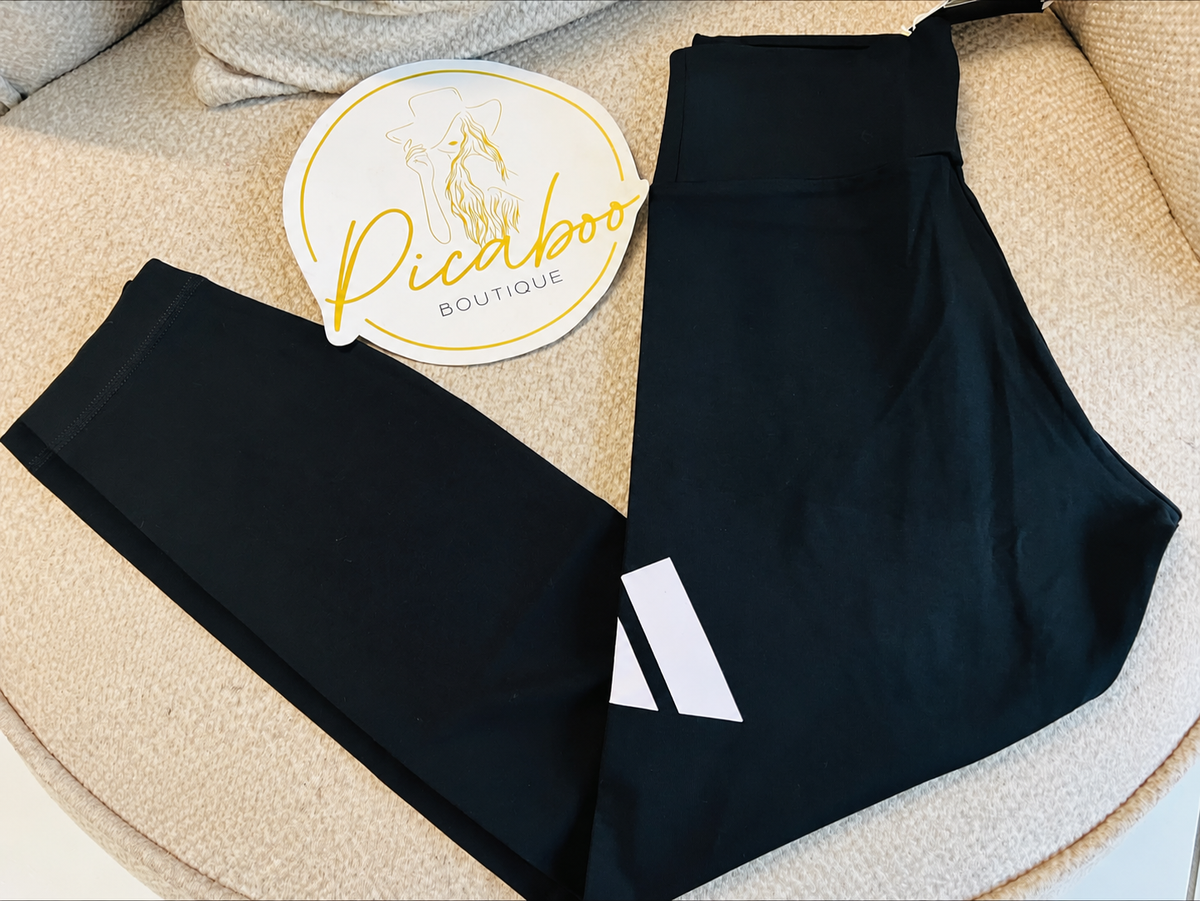 Leggings Adidas negros con logotipo blanco