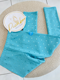 Leggings turquesa con corazones para niña