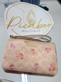 Muñequera Coach floral rosa