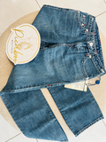 Pantalón de mezclilla azul con detalles rojos para niño