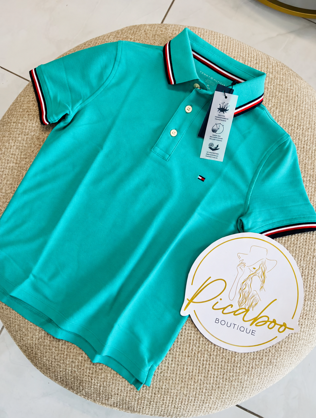 Polo Tommy Hilfiger turquesa con ribetes tricolor para niño