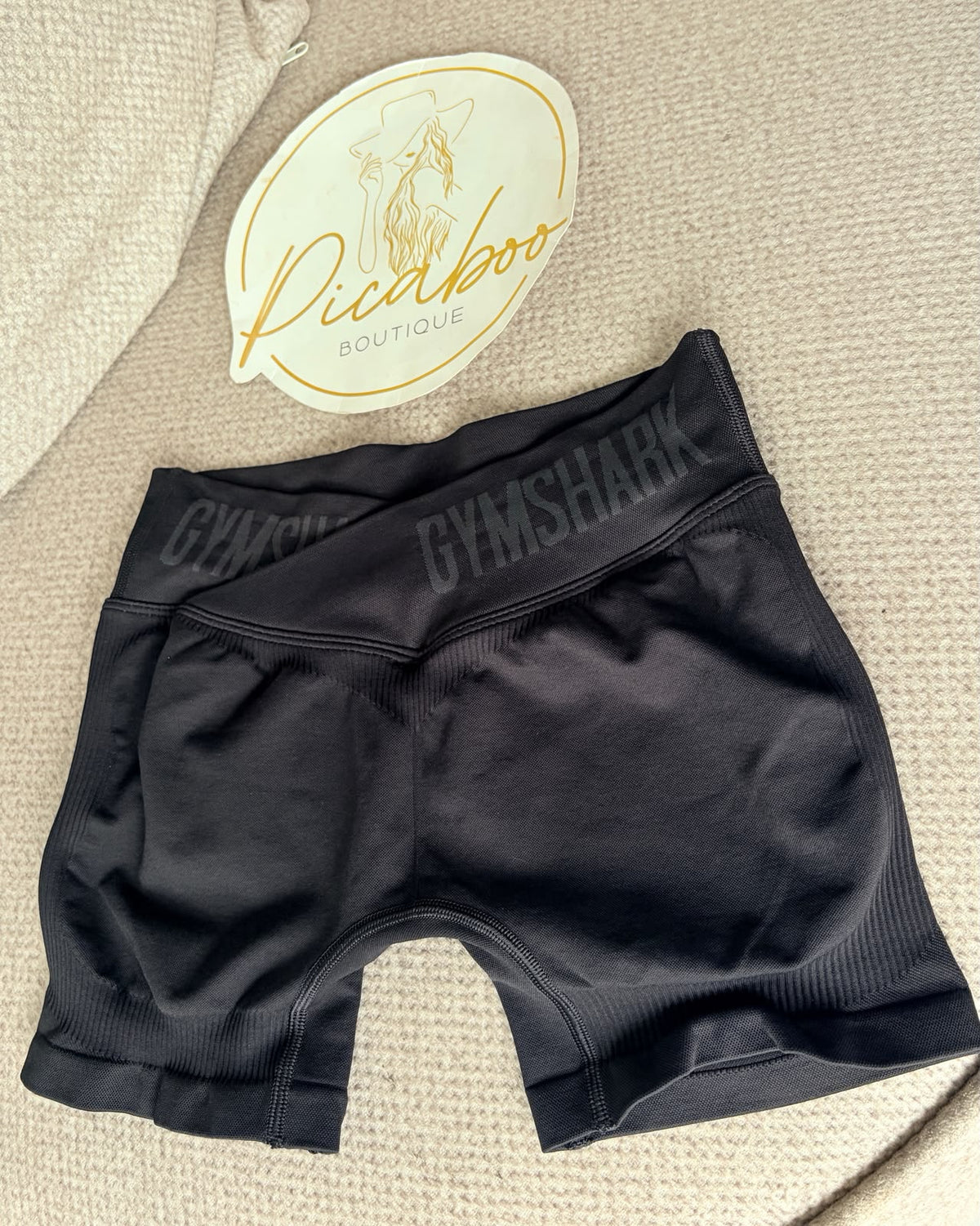 Short deportivo Gymshark negro con pretina cruzada