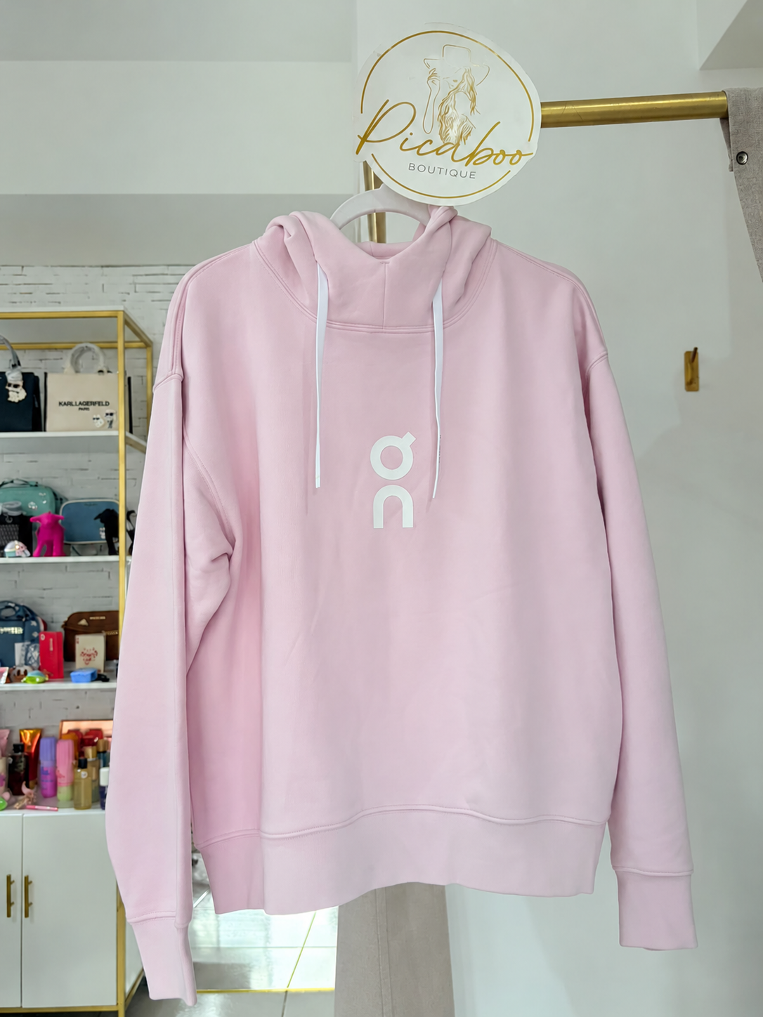 Sudadera On rosa con capucha y logotipo blanco