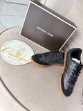 Tenis Michael Kors negros con suela café para caballero